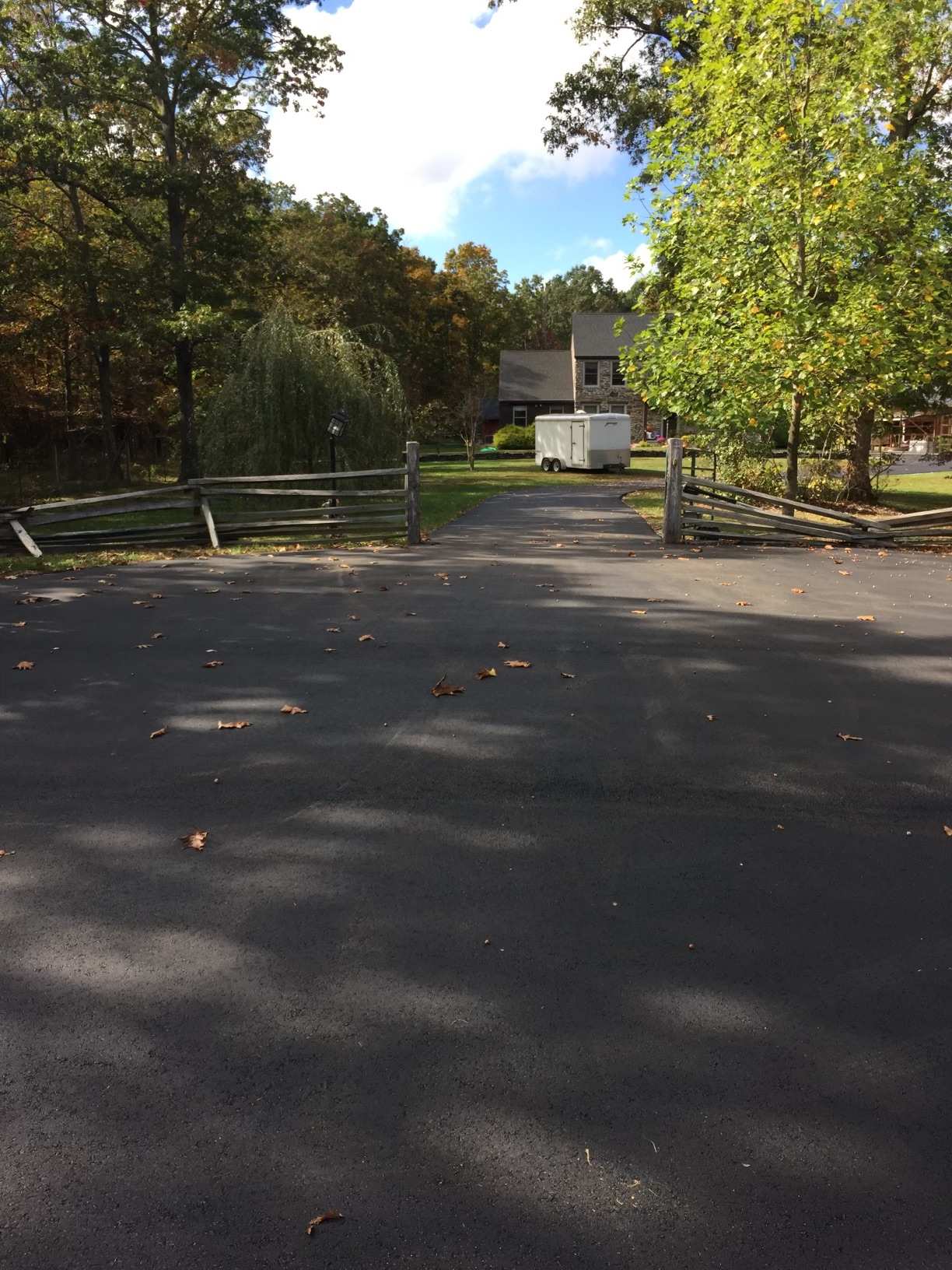 Residential driveway with split rail fence